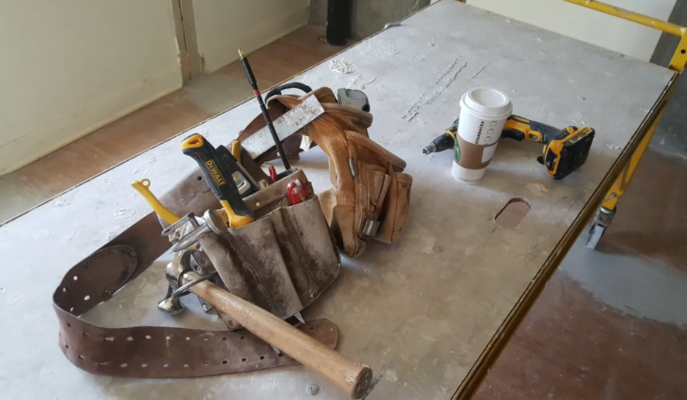 Drywall contractor tools on job site