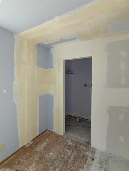Drywall finishing — hallway renovation in progress